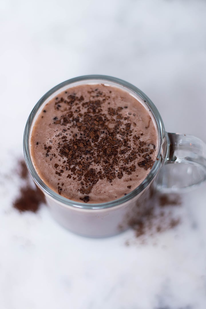 Mocha latte garnished with cocoa powder in a mug ready to be enjoyed. 