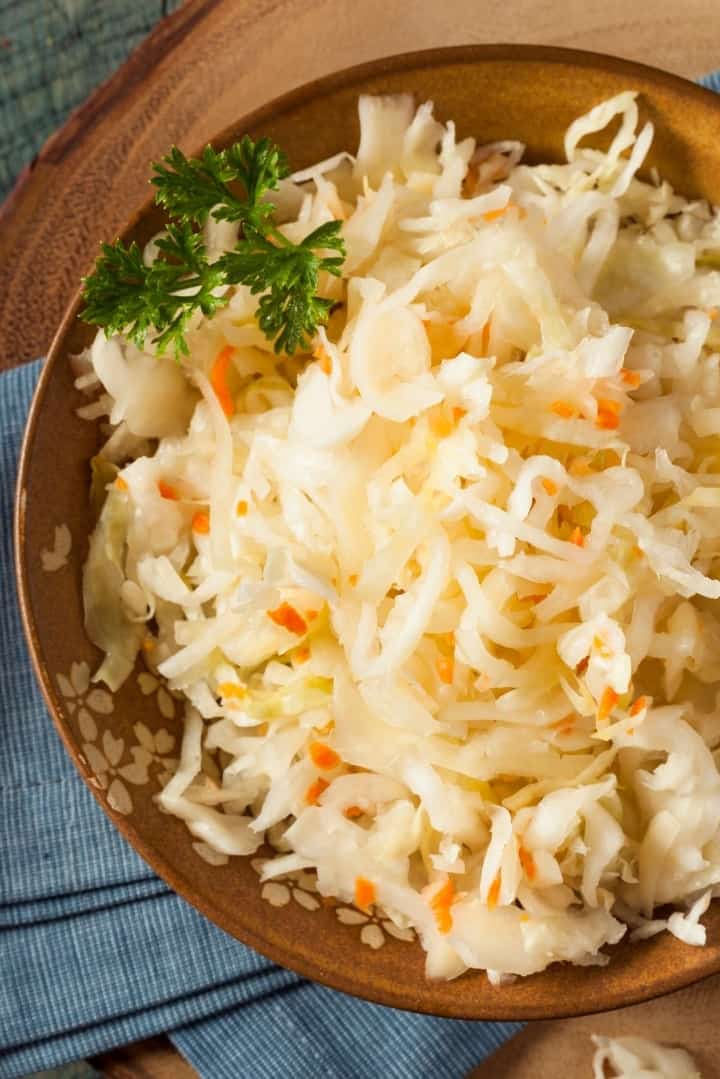 Did you know that this often-enjoyed side dish is extra good for you? Sauerkraut is a probiotic food and should be included in your diet. This post will explain the 9 benefits of sauerkraut and why you should eat it every day!